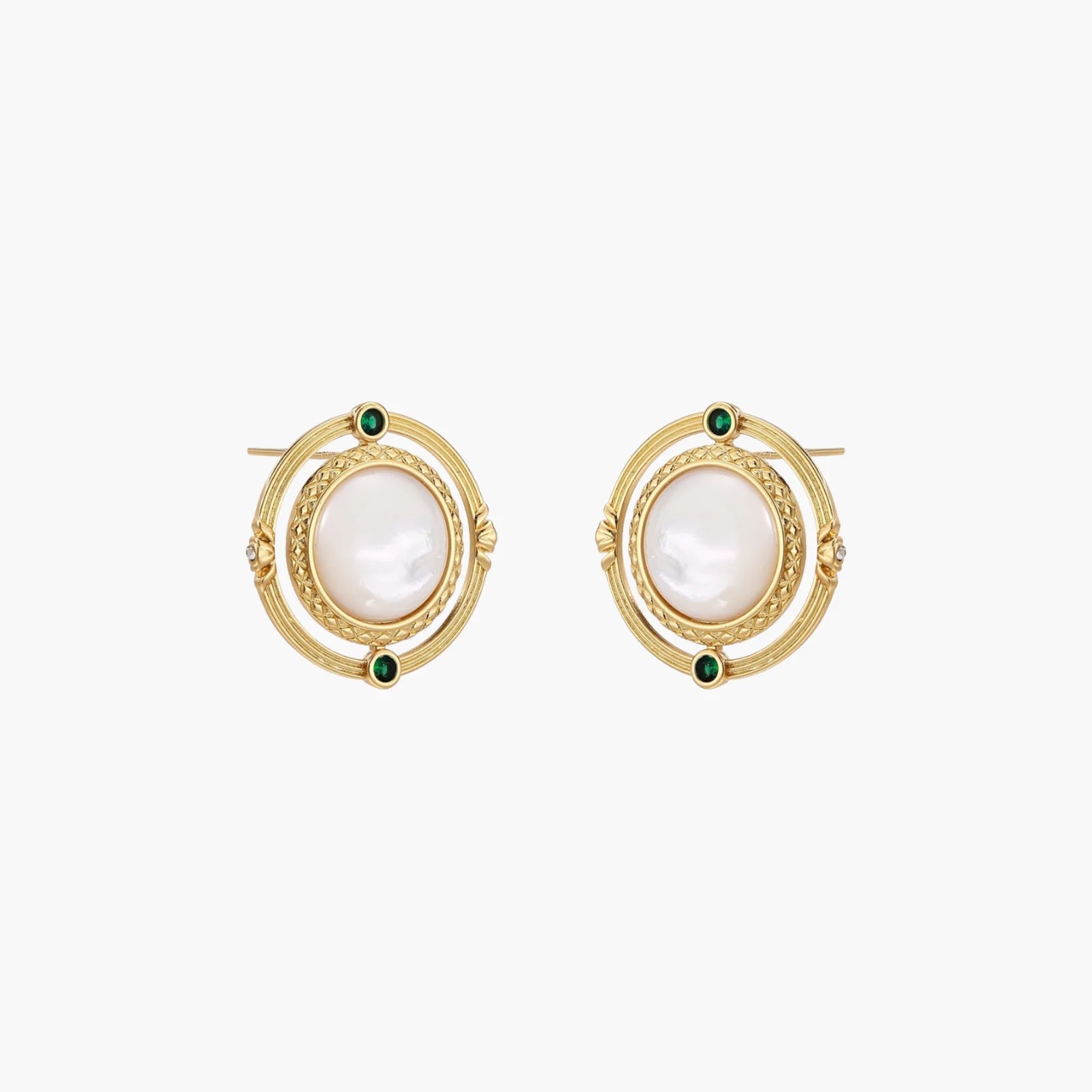 Circular gold stud earrings with iridescent mother-of-pearl center and green zirconia accents on cream background.