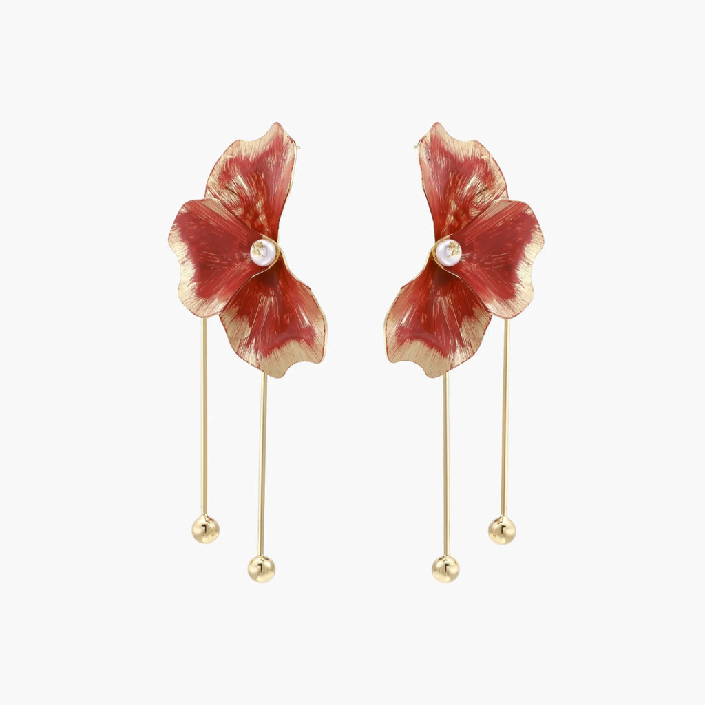 Red enamel flower earrings with gold-plated stems, central pearl, and gradient coral-to-gold petals on white background