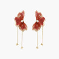 Red enamel flower earrings with gold-plated stems, central pearl, and gradient coral-to-gold petals on white background