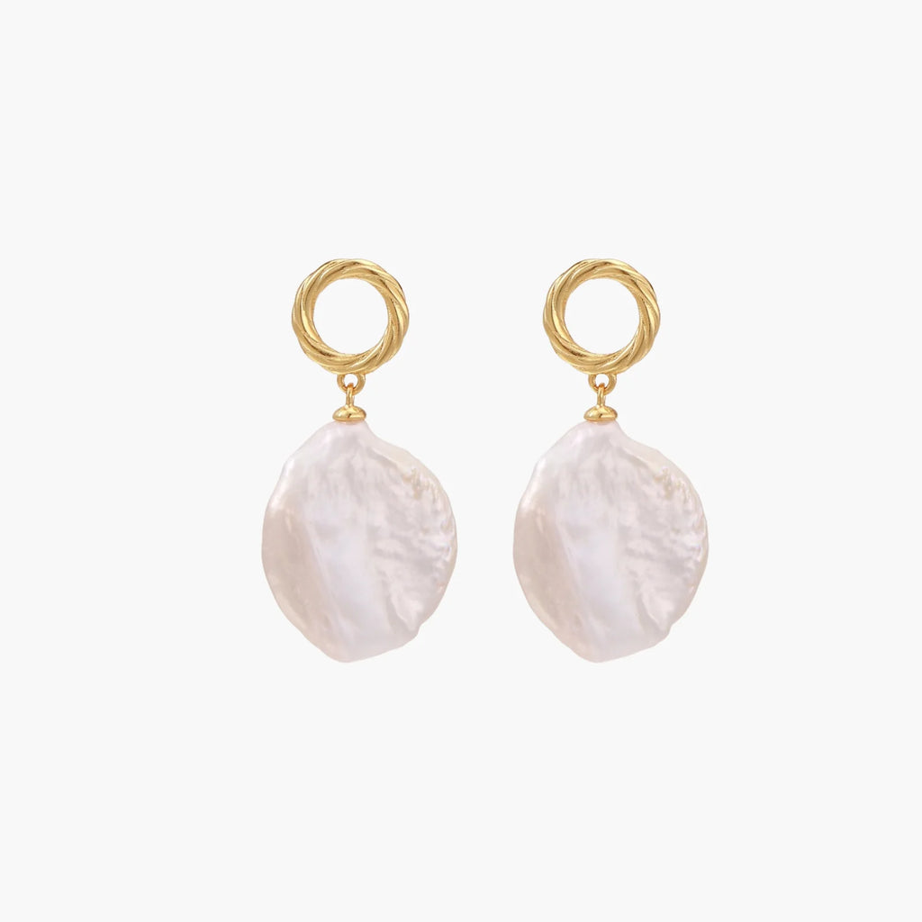 18K gold vermeil twisted circle studs with organic white baroque pearl drops on cream background