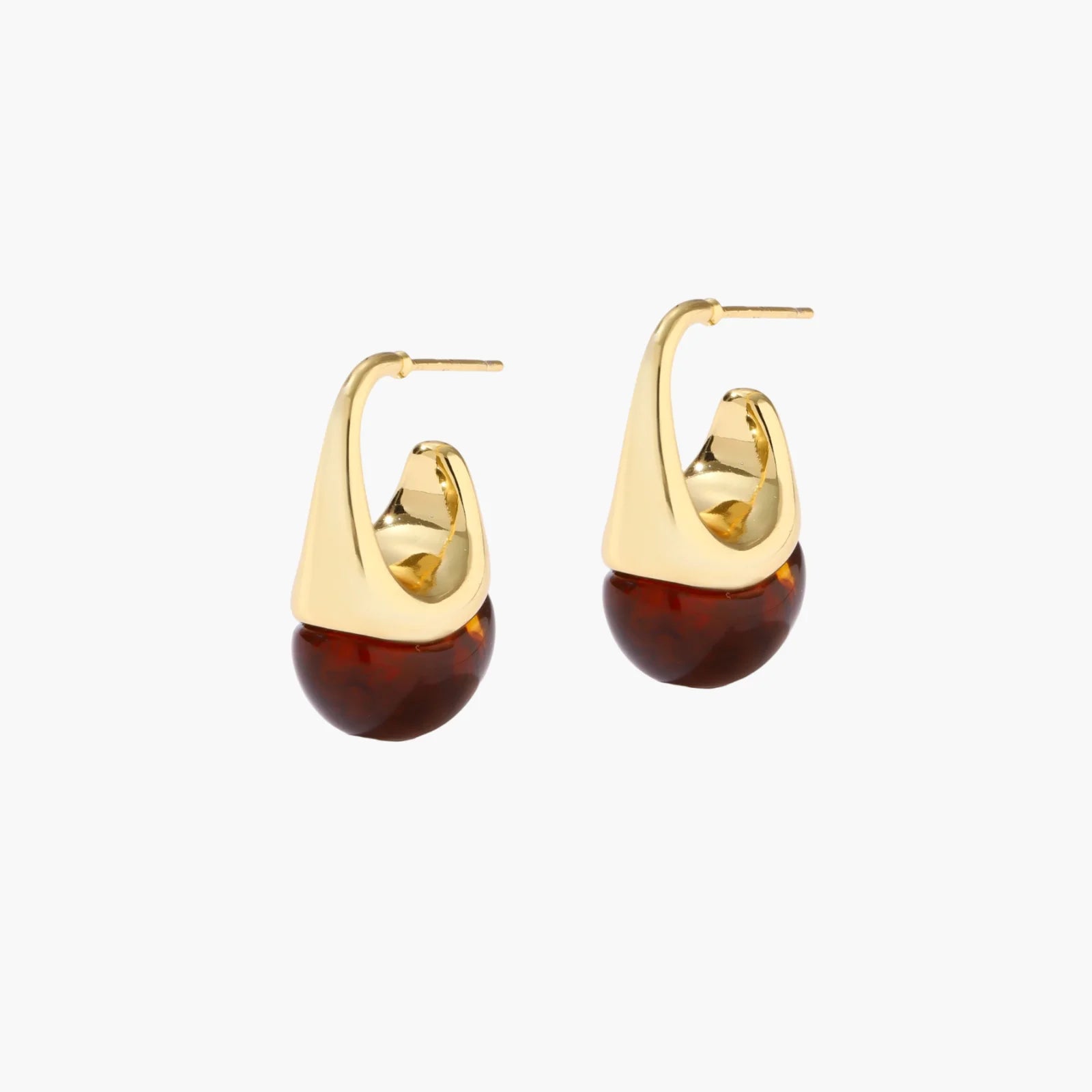 Modern drop earrings with curved gold-plated copper tops and amber resin bottoms creating an organic teardrop silhouette.