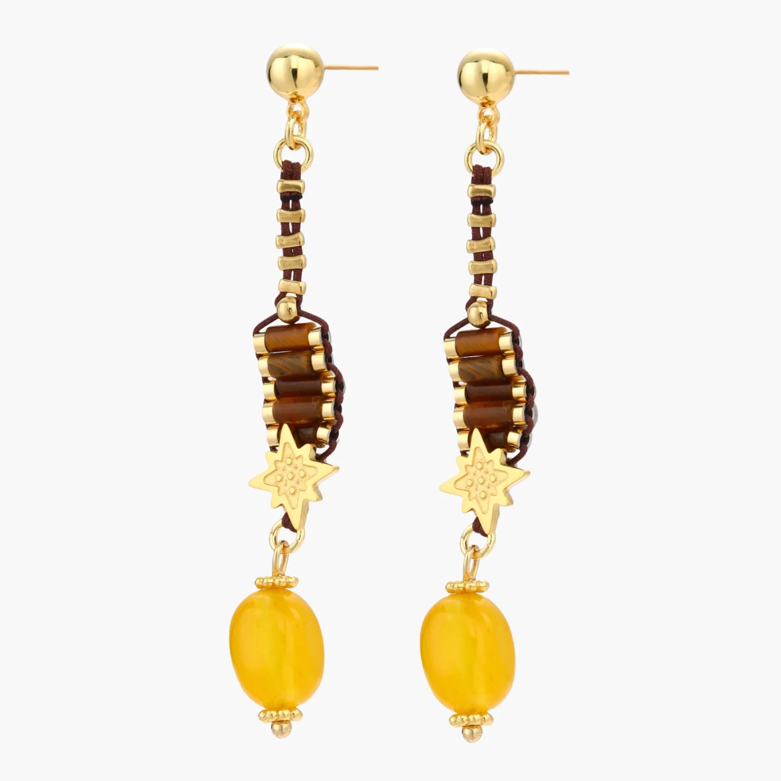 Gold-plated dangle earrings with brown gemstones, star charms, and yellow amber drops on cream background.
