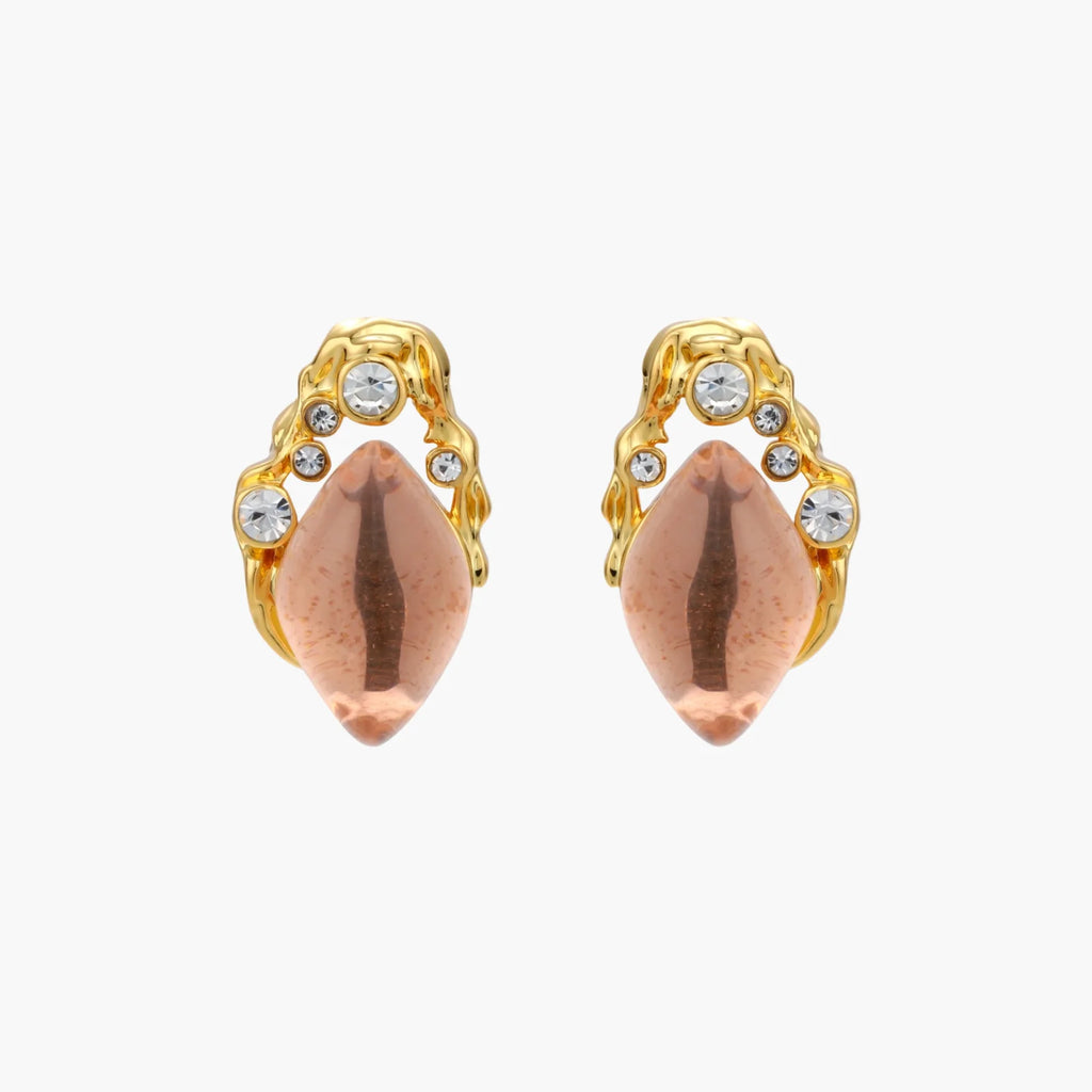 Gold-plated baroque stud earrings with coral-pink liuli stones and cubic zirconia crystals on white background.