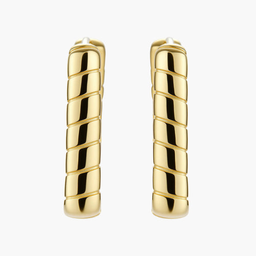 Chunky segmented gold-plated huggie hoop earrings with bamboo-inspired geometric design on white background.