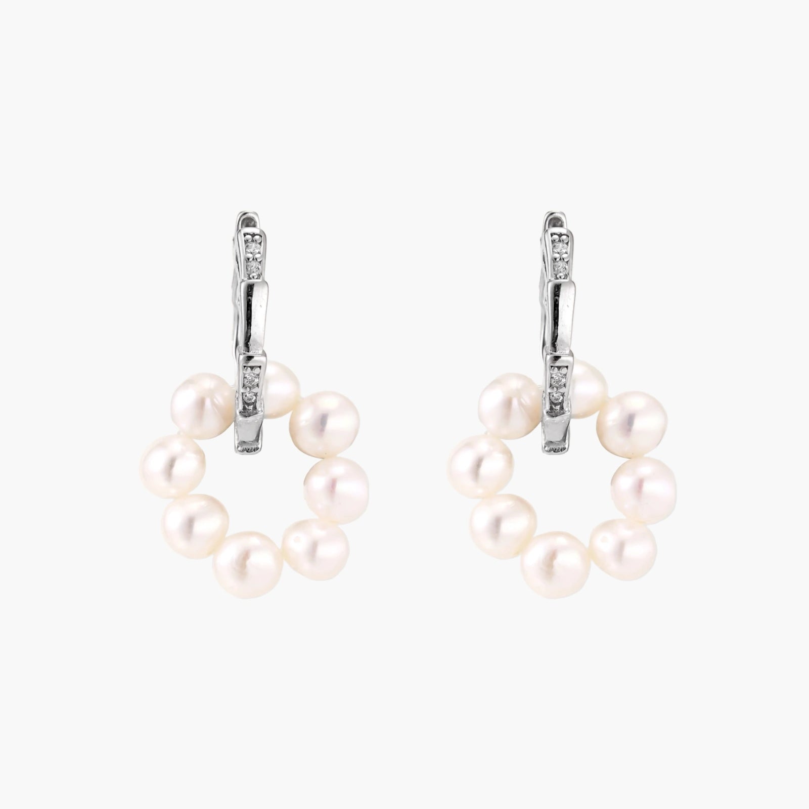 Rhodium-plated silver hoop earrings with freshwater pearls arranged in crescent formation and diamond accents