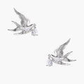 Silver-toned swallow stud earrings with detailed wings carrying teardrop zirconia crystals on white background