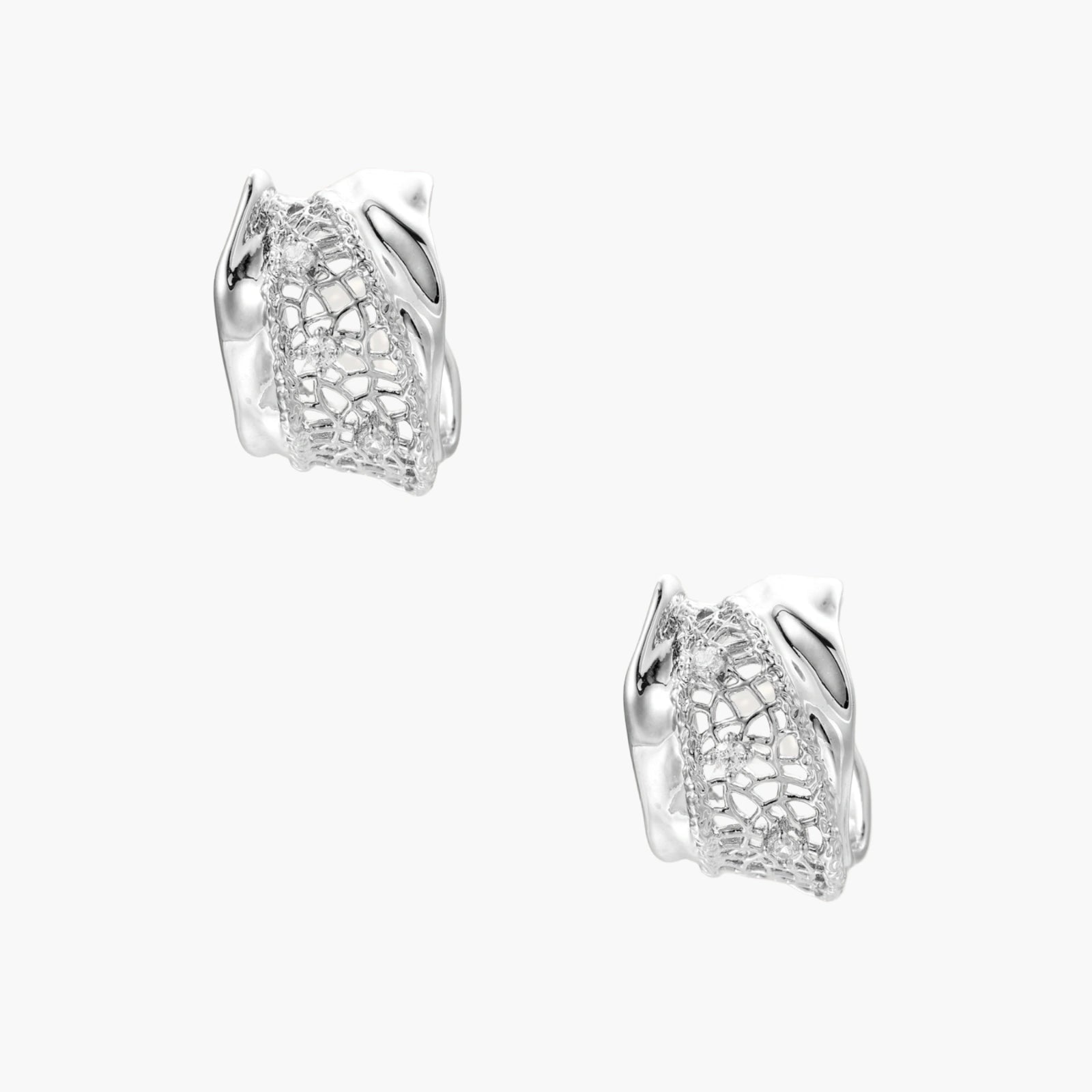 Close-up of sculptural hoop earrings with lattice center band and smooth twisted edges in white gold-plated brass with zirconia