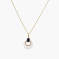 Gold necklace with navy lapis lazuli stone and iridescent mother-of-pearl teardrop pendant with crystal accents