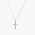 Gold-plated stainless steel cross necklace with crystal embellishments on adjustable chain against light background.