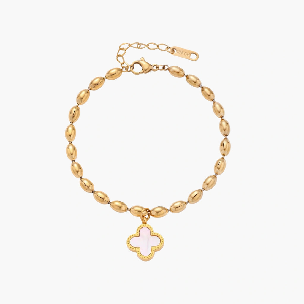 18K gold-plated oval bead chain bracelet with quatrefoil clover charm featuring mother of pearl inlay on cream background