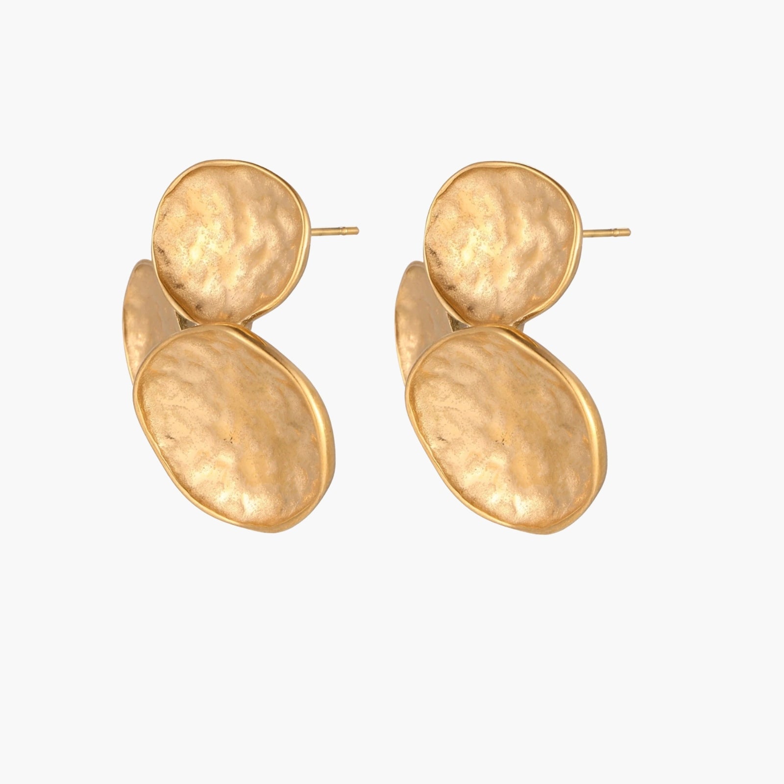Three hammered gold discs clustered together forming organic statement earrings with textured surfaces
