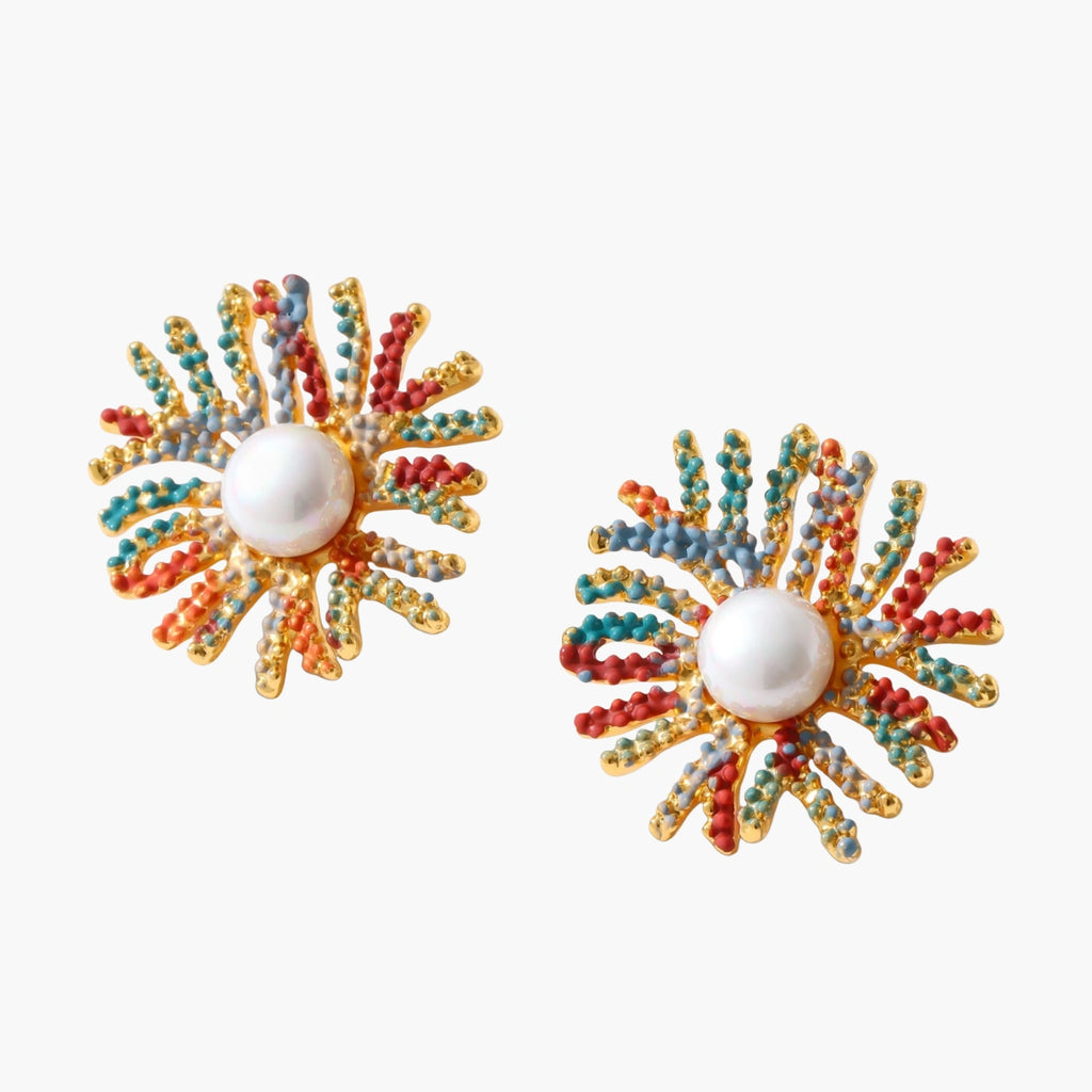 Vibrant starburst stud earrings with multicolor enamel rays and white pearl centers on gold-plated setting