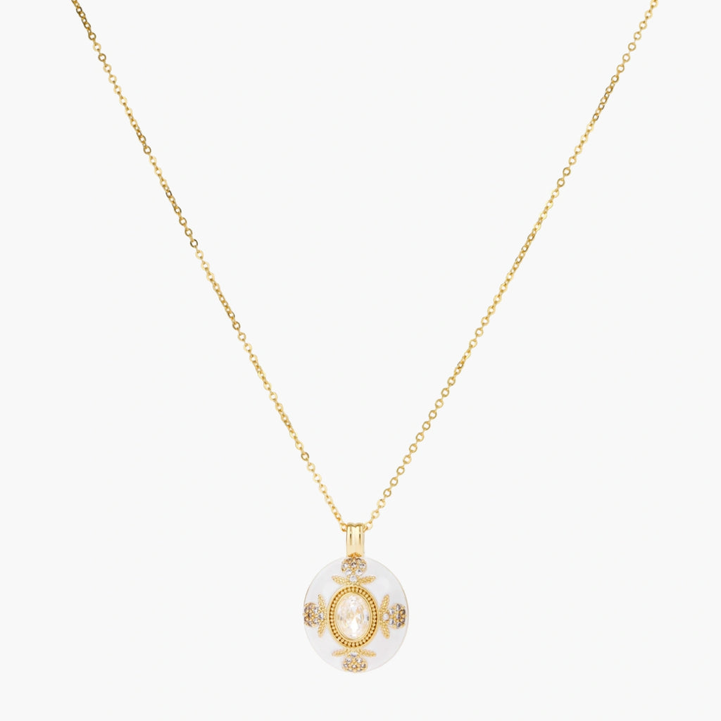 Gold-plated necklace with circular white enamel pendant featuring central zirconia stone and ornate decorative details