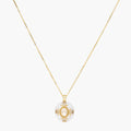Gold-plated necklace with circular white enamel pendant featuring central zirconia stone and ornate decorative details