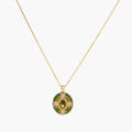 Gold-plated pendant necklace with green enamel background and oval olive cubic zirconia center stone with crystal accents.