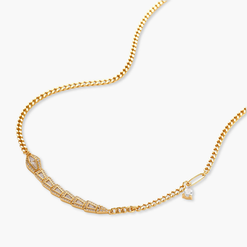 Gold-plated necklace with geometric diamond segments and matching huggie earrings featuring cubic zirconia details